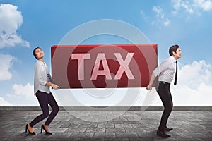 Business teamwork carrying heavy tax burden