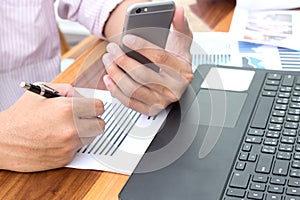 business technology concept,Business people hands use smart phone and laptop