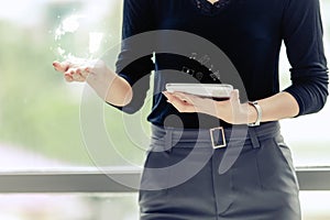 Business technology concept businesswomen holding working on tablet