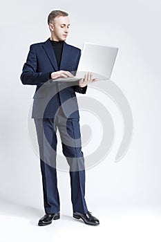 Business and Technology Concept. Portrait of Young and Smiling H