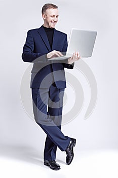 Business and Technology Concept. Portrait of Young and Smiling H