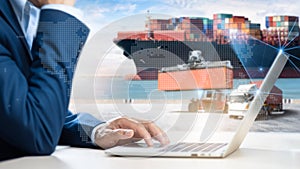 Business and Technology Digital of Cargo Containers Logistics Transport Concept, Business man using Tablet and Freight Ship