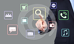 Business, technology and internet concept - businessman pressing Search button on virtual screens