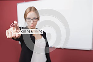 Business, technology, internet concept - businesswoman pressing online training button on virtual screens