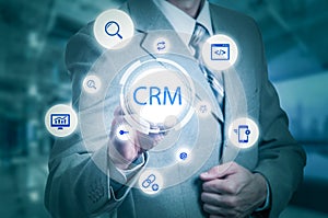 Business, technology, internet and customer relationship management concept. Businessman pressing crm button on virtual screens