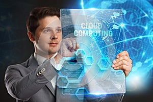 Business, Technology, Internet and network concept. Young businessman showing a word in a virtual tablet of the future: Cloud comp