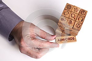 Business, Technology, Internet and network concept. Young businessman shows the word: AdWords
