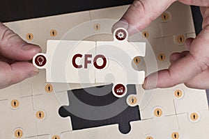 Business, Technology, Internet and network concept. Young businessman shows the word: CFO