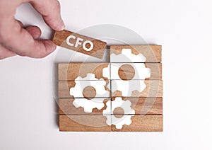 Business, Technology, Internet and network concept. Young businessman shows the word: CFO