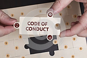 Business, Technology, Internet and network concept. Young businessman shows the word: Code of conduct