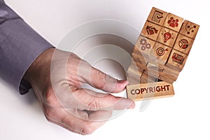 Business, Technology, Internet and network concept. Young businessman shows the word: Copyright