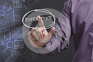 Business, Technology, Internet and network concept. Young businessman shows the word: Experience