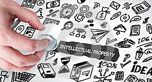 Business, Technology, Internet and network concept. Young businessman shows the word: Intellectual property