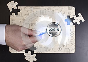 Business, Technology, Internet and network concept. Young businessman shows the word: Login