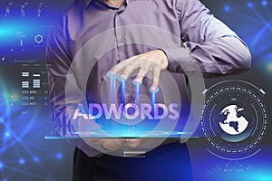 Business, Technology, Internet and network concept. Young businessman shows the word on the virtual display of the future: AdWords