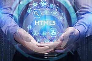 Business, Technology, Internet and network concept. Young businessman shows the word on the virtual display of the future: HTML5