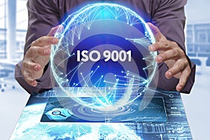 Business, Technology, Internet and network concept. Young businessman shows the word on the virtual display of the future: ISO