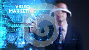 Business, technology, internet and network concept. Young businessman thinks over the steps for successful growth: Video marketing