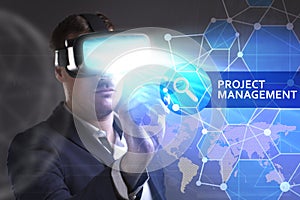 Business, Technology, Internet and network concept. Young businessman working in virtual reality glasses sees the inscription: