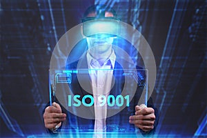 Business, Technology, Internet and network concept. Young businessman working in virtual reality glasses sees the inscription: ISO