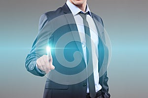 Business, technology, internet and networking concept - businessman pressing button with contact on virtual screens. World map