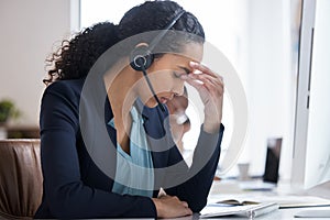 Business, telemarketing and woman with headache, call center and customer service in office. Consultant, help desk and