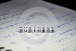 Business Text on Management Notebook