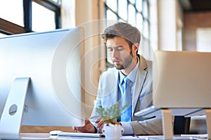 Business, thinking and man with a computer, internet and solution with problem solving, website info and ideas. Person