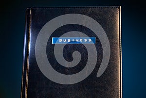 Business title on leather organiser book