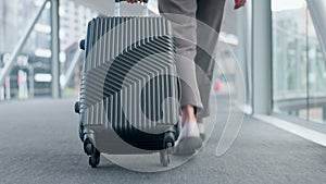 Business, travel and feet walking in airport with luggage for journey to convention, conference or employee on work trip