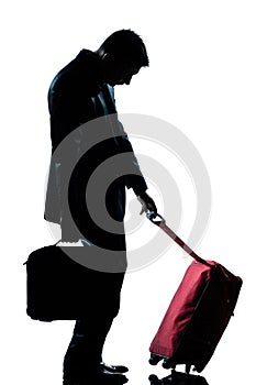 Business traveler man tired with suitcase