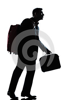 Business traveler man walking with suitcase