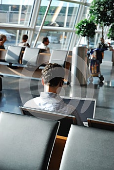 Business traveler waiting in an airport lounge