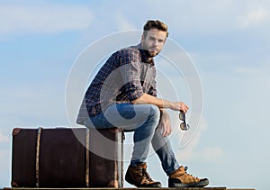 Business trip. Handsome guy traveler. Guy outdoors with vintage suitcase. Luggage concept. Travel with luggage. Travel