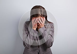 Business unhappy depression woman in suit covering the hand the