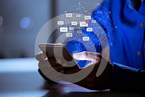 Business using smartphone ,with email icon, email inbox electronic communication graphics concept