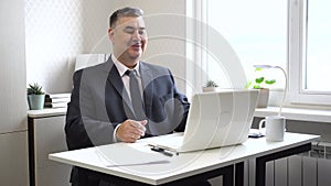 Business Video Call: Man in Suit Smiling and Chatting