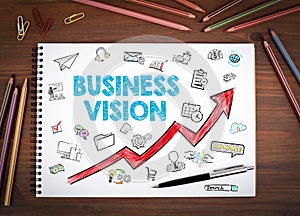 Business Vision Concept. Notebooks, pen and colored pencils on a wooden table