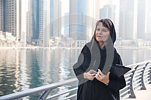 Business woman in an abaya.