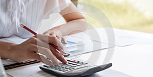 Business woman or accountant working in finance and accounting Analyze financial budget - work from home concept