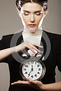 The business woman with an alarm clock