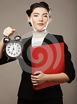 The business woman with an alarm clock