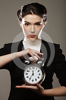 The business woman with an alarm clock