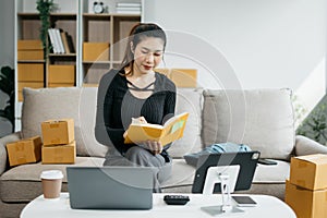 Business woman analyzes business data, busy working on laptop computer and business report on office desk, business strategy