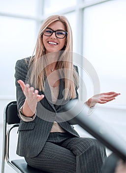 Business woman answering questions during an interview.