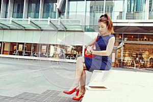 Business woman on background with a smart phone