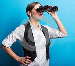 Business woman with a binoculars