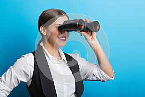 Business woman with a binoculars