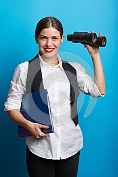 Business woman with a binoculars