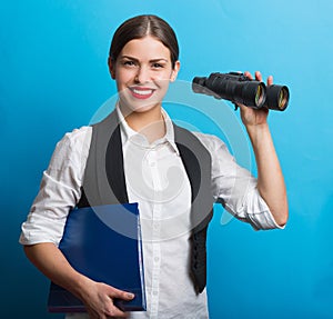 Business woman with a binoculars